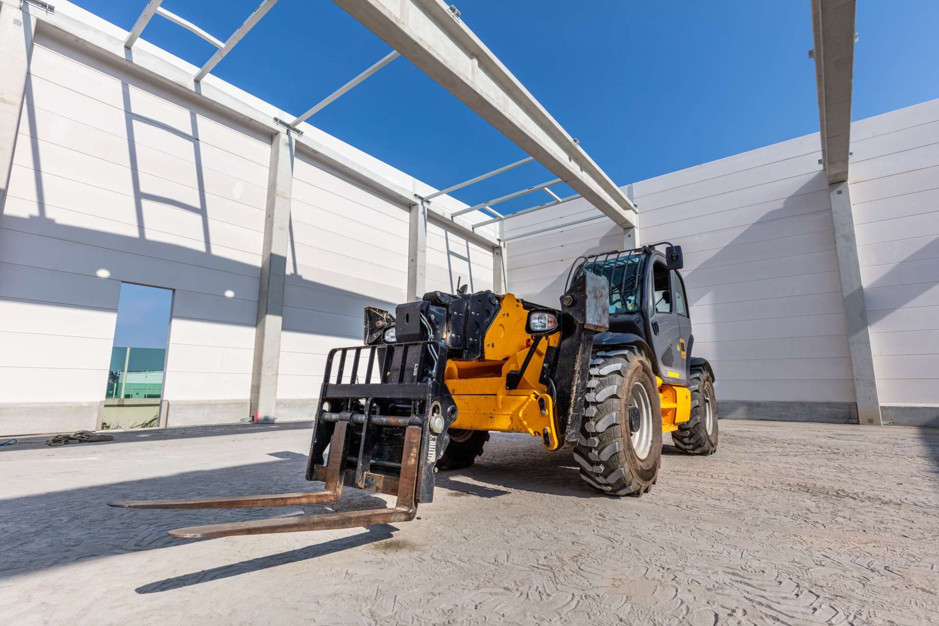 a potential buyer inspecting construction equipment
